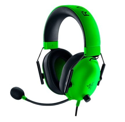 Green wired gaming headset with padded black ear cushions, adjustable headband, and microphone attached to the left ear cup