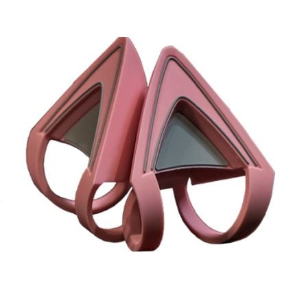 Pair of pink, geometric triangular stands with curved bases facing each other.