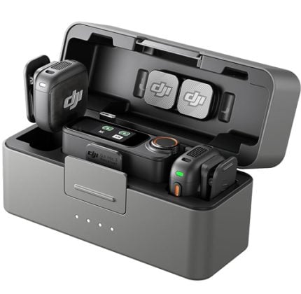 Open DJI charging case showing two spare drone batteries and a compact charging hub inside the lid as a charging station for accessories.