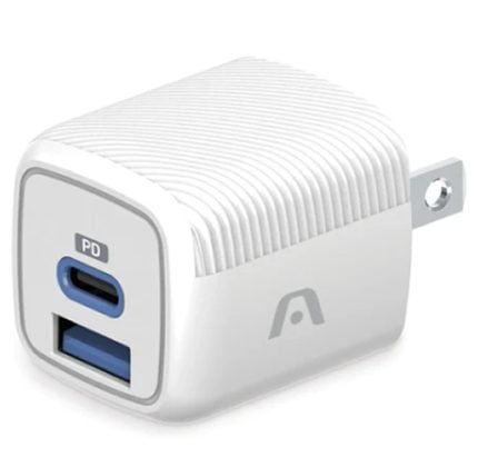 White compact wall charger with two ports: USB‑C PD and blue USB‑A, shown from an angled perspective with prongs on the side edge.