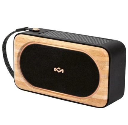 Portable Bluetooth speaker with a wooden front and black fabric grille, plus a carrying strap on top edge.