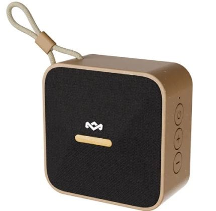Portable Bluetooth speaker with a bronze body, black front grille, and a fabric strap attached at the top left side
