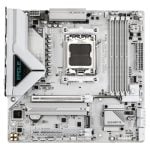 White/gray Gigabyte motherboard with LGA socket and dual-channel RAM slots, I/O ports along bottom edge, M.2 slot, PCIe slots, and chipset heatsink visible.