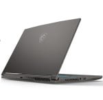 Slim black gaming laptop, angled open with MSI shield logo on the lid and side vents visible.