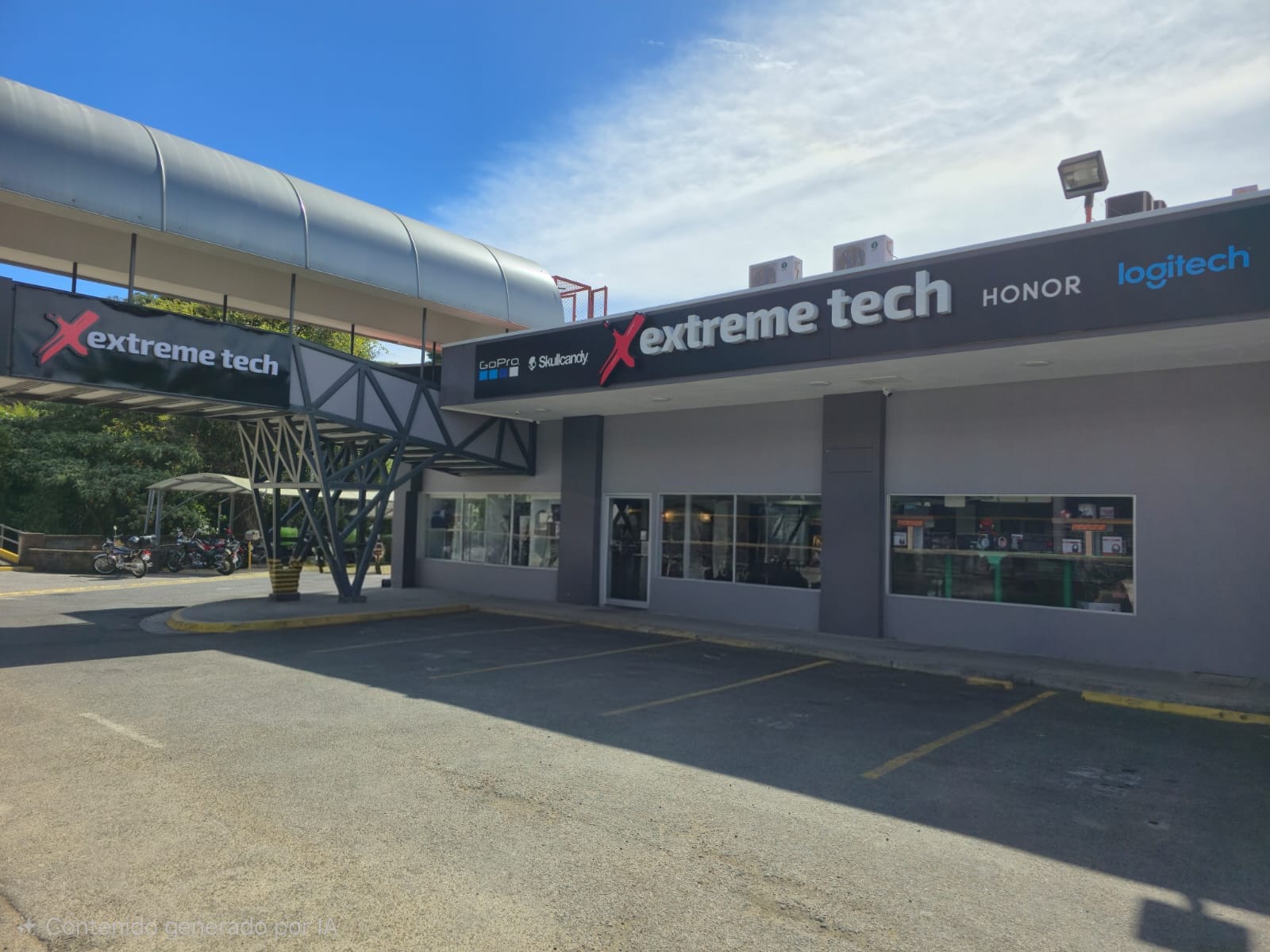 Exterior view of an extreme tech store with banners for GoPro and Skullcandy, and motorcycles parked outside under a large canopy.
