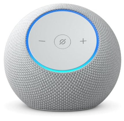 Spherical smart speaker with gray fabric and a circular top—ring lit blue, featuring minus, plus, and mic-mute icons.