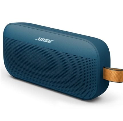 Blue Bose portable Bluetooth speaker with a perforated front grill and a tan strap on the side.