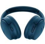 Blue over-ear wireless headphones with cushioned headband and control buttons on the earcups, isolated on white.