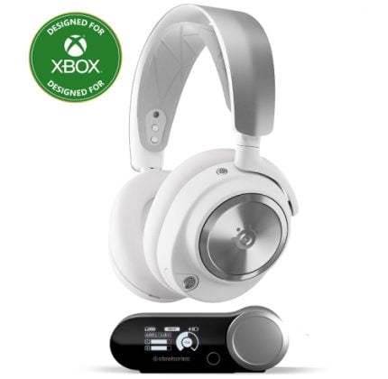White over-ear Xbox headset with silver ear cups and a black charging base.