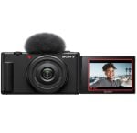 Sony action camera with a flip-out LCD screen showing a smiling person in a sunny outdoor setting; black body with attached mic on top.