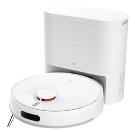 White robotic vacuum cleaner with its charging dock behind it.