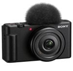 Sony compact camera with a fuzzy windscreen-covered microphone mounted on top, front view