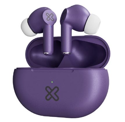Purple wireless earbuds sitting in an open purple charging case with white silicone tips and a small green LED on the front of the case.