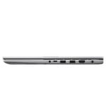 Side view of a silver laptop closed, showing ports along the right edge (USB, HDMI, Ethernet, power, and audio out).