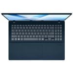 Top-down view of an open dark blue laptop showing keyboard and touchpad.