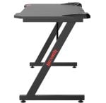 Z-frame standing desk with dark gray top and REDRAGON branding on the leg; adjustable height, leveling feet for stability.