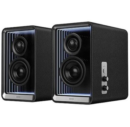 Pair of black desktop speakers with blue accent lighting and visible drivers.