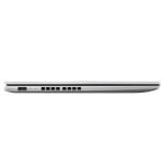 Side view of a thin silver laptop closed, showing ventilation holes and ports along the left edge.