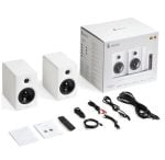 White desktop 2.0 speaker system with two small satellites, remote, cables, manual, and box shown for packaging.