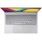 Top-down view of a silver laptop open with a colorful display, full keyboard and centered touchpad.