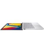 2-in-1 laptop with touchscreen display tilted into tablet mode, showing a vibrant colored screen and silver keyboard.