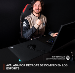 Esports player Erik 'Ofu' Engel of Gaimin Gladiators sits at a desk with keyboard and monitor, smiling, with an interview banner at the bottom mentioning decades of esports dominance.