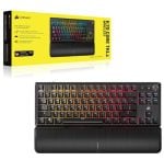 Corsair K70 Core RGB Wireless keyboard with rainbow backlighting and a textured wrist rest, shown in front of its yellow product box.