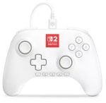 White Nintendo Switch-style wired controller with USB-C cable and red Switch logo in the center, laid flat.