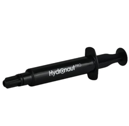 Black HydraNaut Pro syringe-style tool with a plunger and nozzle, branding visible on the body.
