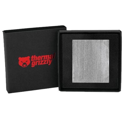 Open black box revealing a square metallic thermal pad set in foam; Thermal Grizzly logo on the lid.