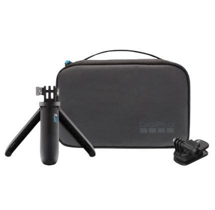 GoPro accessory kit including a small tripod grip, a handheld grip, a black carrying case, and a charging adapter/sock.
