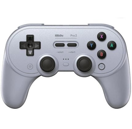 Front view of a light gray 8BitDo Pro 2 gamepad: D-shaped D-pad on the left, two analog sticks, four colored action buttons (X, Y, A, B) on the right, and small center controls.