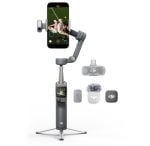 DJI handheld 3-axis gimbal with a smartphone mounted for stabilized mobile video, with nearby accessories for filming.