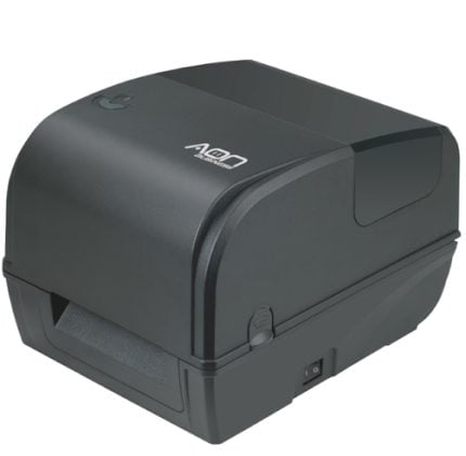 Compact thermal label printer with a curved top and label feed slot at the front, mounted on a base plate.