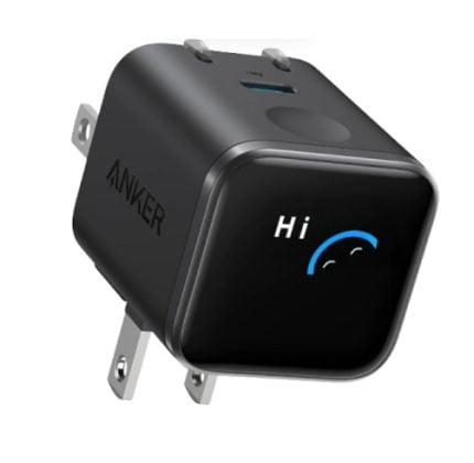 Compact black Anker wall charger with a blue arc smile and the word 'Hi' on the front panel.