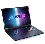 Gaming laptop open at an angle with RGB backlit keyboard and a neon AORUS logo on the screen.