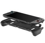 Nintendo Switch handheld console resting on a curved, low-profile docking stand with side grip extensions and detachable Joy-Con controllers on the sides.
