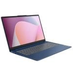 Blue laptop open at a slight angle, keyboard visible and the screen shows a pink abstract wallpaper.