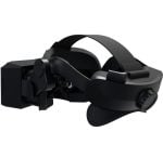 Black virtual reality headset with padded head strap and side dial for fit, shown from the side