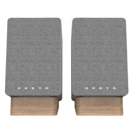 Pair of Onkyo bookshelf speakers with gray fabric covers and light wood bases, viewed from the front
