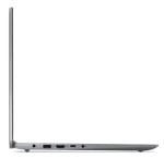 Side view of a slim silver laptop opened at a shallow angle, showing ports (USB, audio jack) along the left edge of the base.