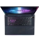 Top-down view of a gaming laptop with a neon-lit RGB keyboard and a colorful logo on the screen.