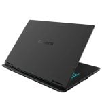 Black gaming laptop open and angled, viewed from the rear with a blue-glow keyboard edge and the Gigabyte logo on the lid.