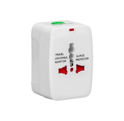 White travel universal adapter with two red outlets and a central plug, labeled 'Travel Universal Adaptor' and 'Surge Protector'