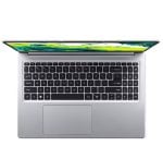 Top-down view of a silver laptop open to reveal a black keyboard and large touchpad, screen with bright wallpaper.