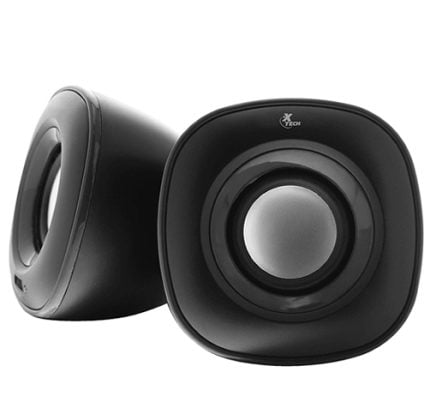 Pair of black computer desktop speakers with silver center cones, angled outward on a white background