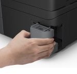 Person inserting a gray toner cartridge into the side of a black printer.
