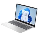 Open silver laptop at a slight angle displaying Windows 11 desktop with app icons on the screen