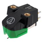 Phono turntable cartridge with a green stylus guard and mounting screws on a black body