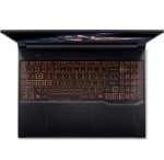 Top‑down view of a black laptop with orange backlit keyboard and a large touchpad.